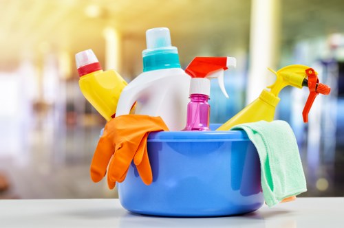 Cleaner responding to a spill using safe control measures